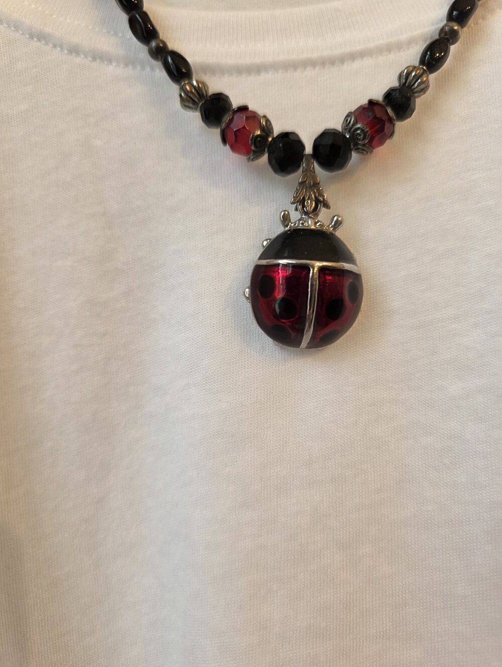 Black Beaded Necklace with Removable Lady Bug Pendant. #12